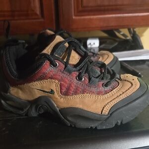 Nike Brown and Black Athletic Shoes with Rugged Sole and Durable Materials